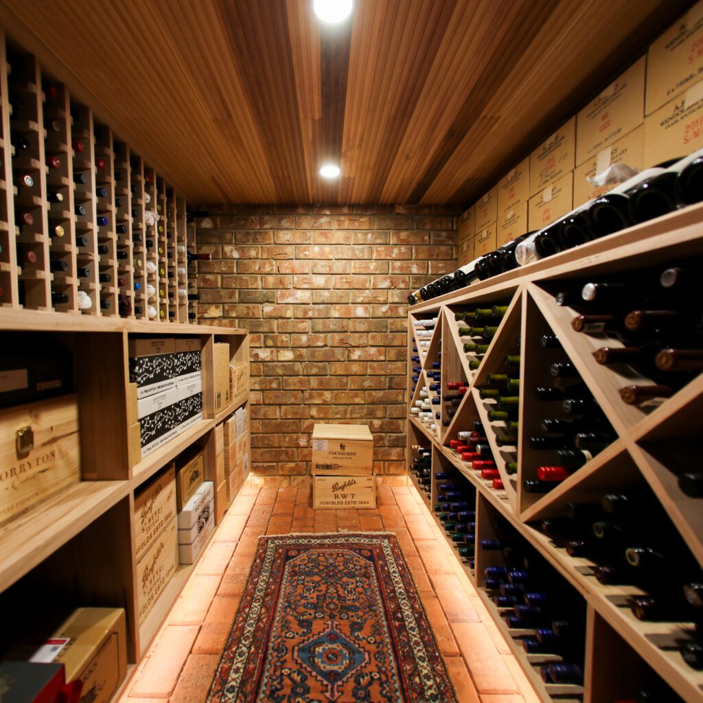 A finished wine cellar with timber racks, the kind of room the wine cellar calculator plans