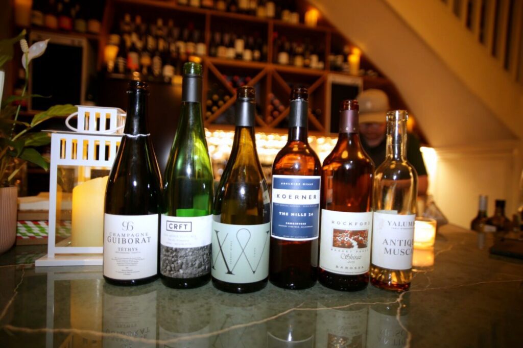 The Round 9 line-up on the bar: Guiborat Champagne, CRFT Grüner Veltliner, Varney Fiano, Koerner Sangiovese, Rockford Basket Press Shiraz and Yalumba Antique Muscat