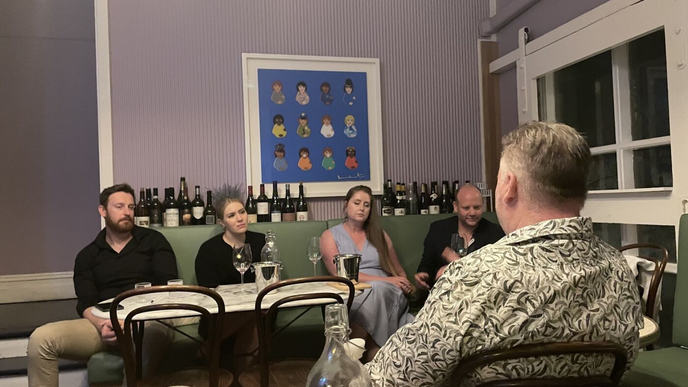 Wine masterclass Adelaide: a host talking guests through a tasting on the green banquette upstairs at Bar Septimus